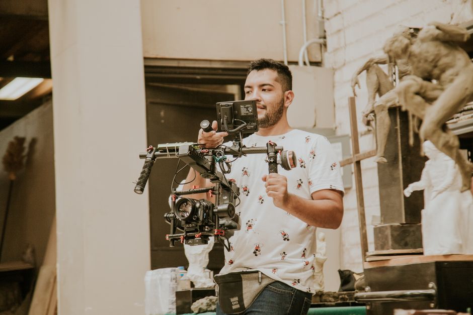 Videographer filming a wedding ceremony