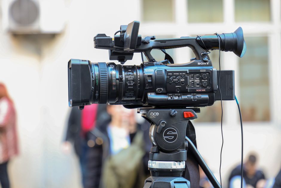Professional wedding videographer with camera gear